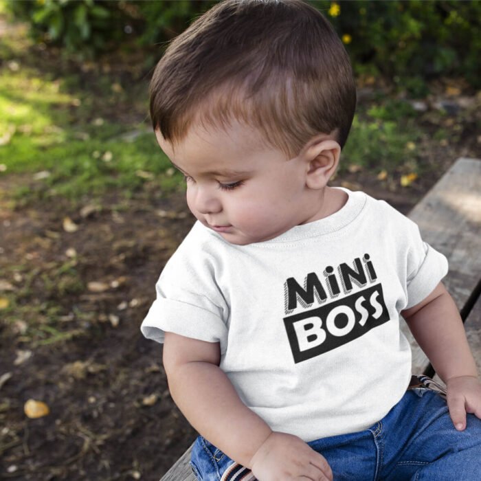 mockup-of-a-baby-boy-looking-down-to-the-floor-while-wearing-a-tshirt-a16086.png